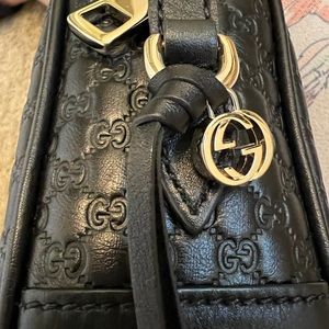 Gucci Guccissima black crossbody/shoulder bag.
